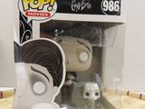 a close up of a pop vinyl figure in a box on a table