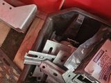 a red tool box with tools in it on the floor