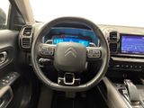 a picture of the interior of a car with a steering wheel