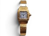 an image of a gold watch with a white face on a white surface