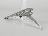 a metal object that is sitting on a clear stand