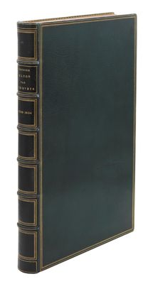 un livre vert avec des bordures dorées et une couverture noire