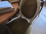 a table with a book on it and a chair with a book on it