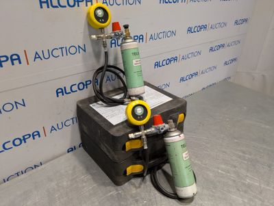two different types of air compressors sitting on a box
