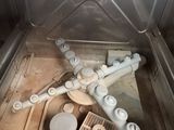 a metal box with a bunch of pipes inside of it