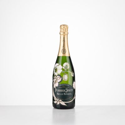 a bottle of champagne on a table with a white background