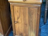 pair of antique wooden nightstands with drawers and drawers on top of them