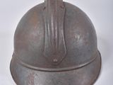 an old helmet on a white surface with a white background