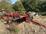 an image of a tractor and a plow in a field
