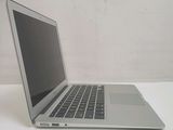 a laptop that is sitting on a white table