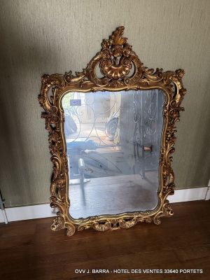 a mirror that is sitting on the floor in a room