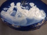 a picture of a blue and white box with a picture of angels on it
