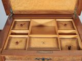 a wooden box that has a drawer inside of it