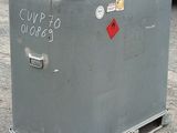 a metal box with a sign on it sitting in a parking lot