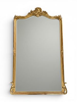 a gold framed mirror on a white wall with a white background