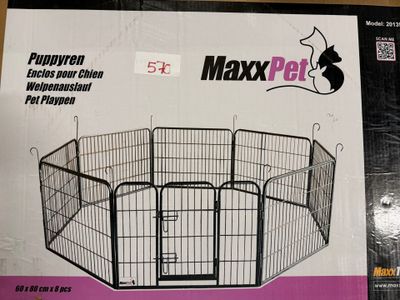 emballage d'un parc pour chien en vente, posé sur une table