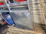 a large metal cabinet in the middle of a room