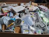 a cardboard box full of assorted items in a room