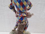 figurine of a man with a hat and a cane