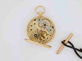 an image of a pocket watch with a chain and a needle