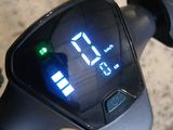 a close up view of a digital clock on the handlebar of a bike