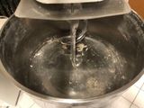 a mixer that is sitting on the counter in the kitchen