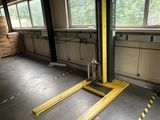 a fork lift in the middle of a large room