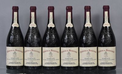 six bottles of wine are lined up in a row on a table