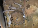 a close up of a clock that has gears on it
