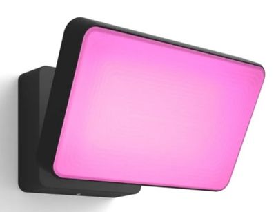 a close up of a pink light mounted on a wall