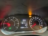 a close up of a car dashboard with a speedometer and gauges