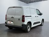 citroen van parked in a large room with white walls