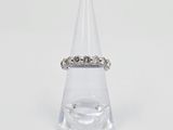 an image of a diamond ring sitting on top of a clear cone