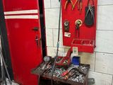 a workbench with tools on it in a garage