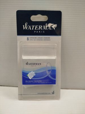 un gros plan sur un tube de dentifrice Waterman posé sur une table