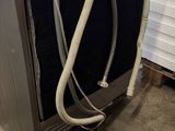 an image of a kitchen appliance with a hose attached to it