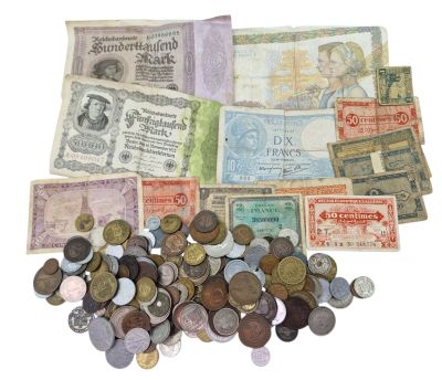 a pile of old foreign currency on a white surface
