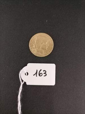 a close up of a coin with a tag on it