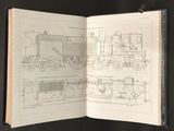 an open book with a drawing of a train on it