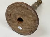 a wooden spool with a hole in the middle of it
