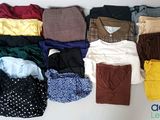 many different types of clothes laid out on a table