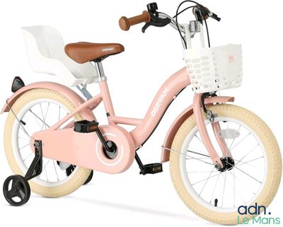 un vélo rose avec un panier à l'arrière