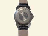 a close up of a watch on a white background