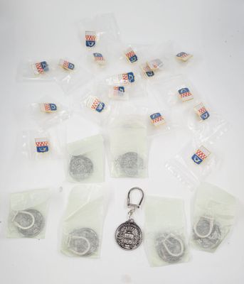 a lot of bags of tea bags and a keychain on a table