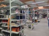 many shelves in the store with various items on them