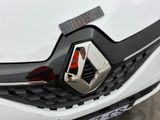 a close up of a car with a badge on it