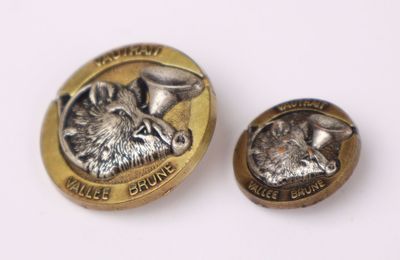 an image of a coin with a picture of a dog on it