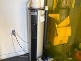 a refrigerator and a refrigerator freezer in the corner of a room
