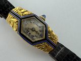 an image of a gold and blue watch on a black leather strap