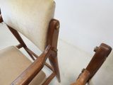 two chairs that are next to each other on the floor